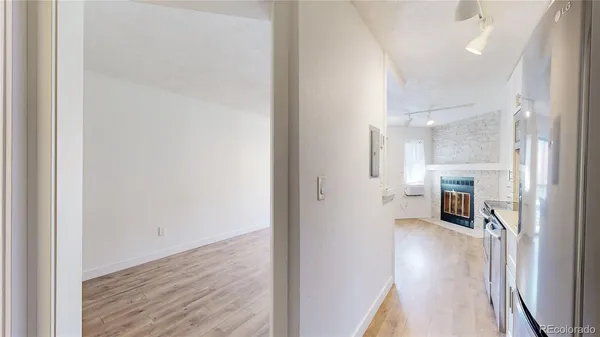 a view of a living room with a fireplace