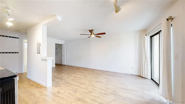 a view of a living room with a fireplace