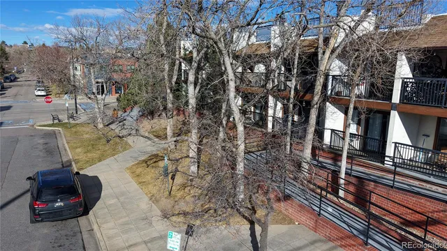 a view of a brick house with large windows