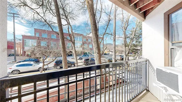 a view of balcony with furniture