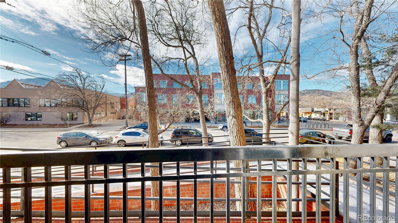 1934 18th Street, Unit 8 Boulder, CO 80302 - Photo 24 of 41 a city view from a balcony with furniture