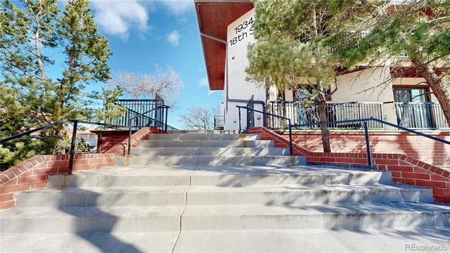 a view of a building with large tree