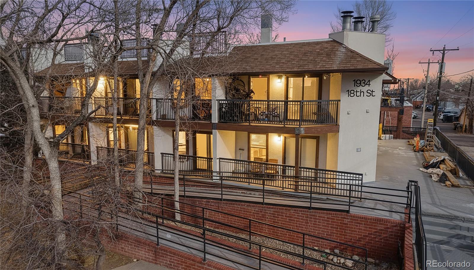 1934 18th Street, Unit 8 Boulder, CO 80302 - Photo 3 of 41 a view of a brick house with large windows