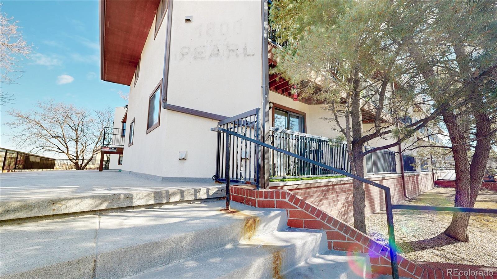 1934 18th Street, Unit 8 Boulder, CO 80302 - Photo 32 of 41 a view of a building with large tree