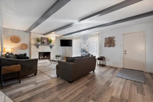 a living room with furniture and a fireplace