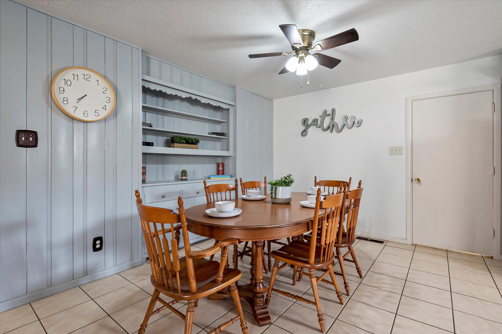 4904 15th Street Lubbock, TX 79416 - Photo 20 of 29 a view of a dining room with furniture and a clock