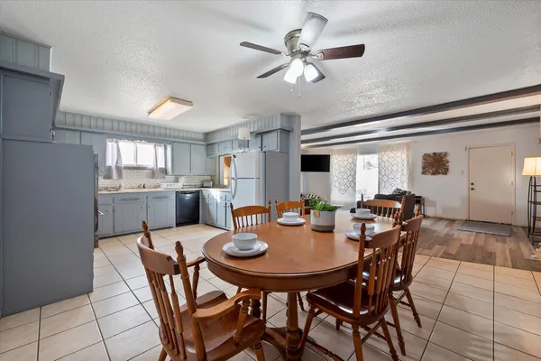a view of a dining room that has a table and chairs