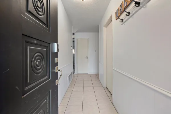 a view of a storage & utility room with a sink