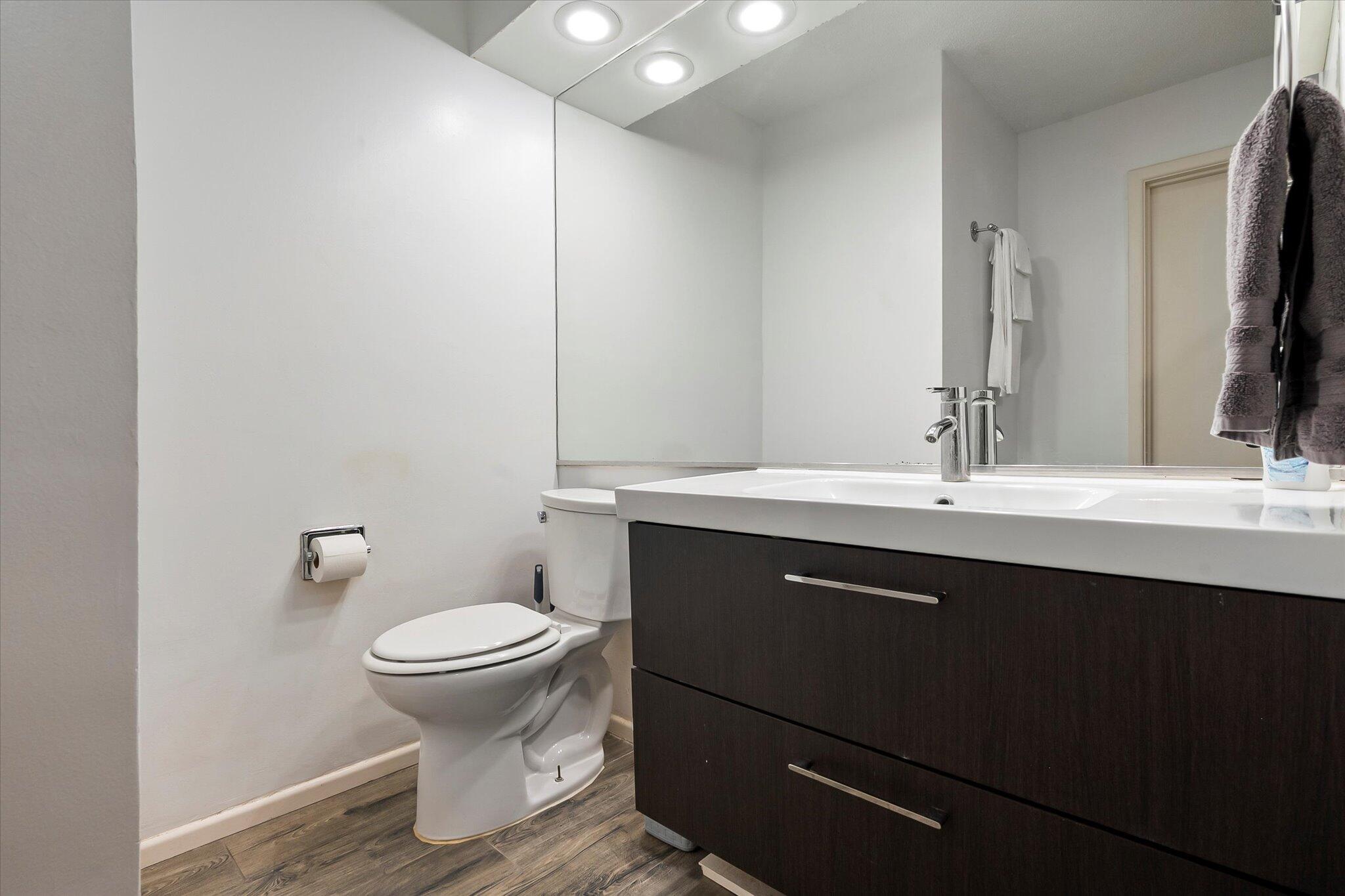 4904 15th Street Lubbock, TX 79416 - Photo 8 of 29 a bathroom with a sink and a toilet