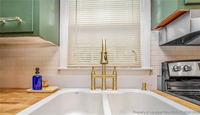 a view of lobby with a tub and mirror