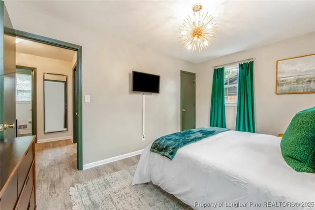 a bedroom with a bed and a chair