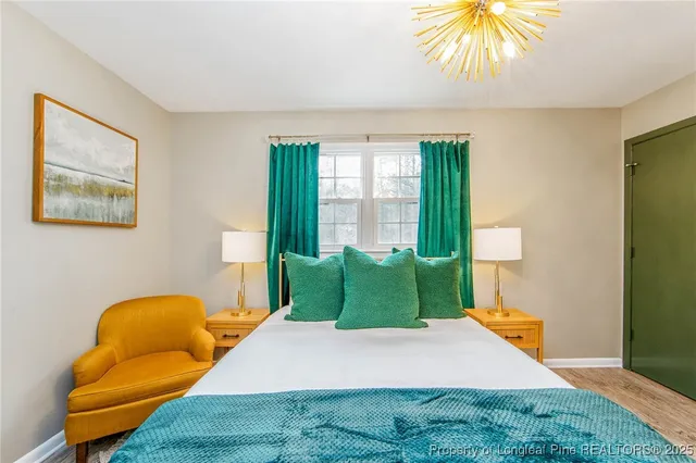 a bathroom with a window and a potted plant