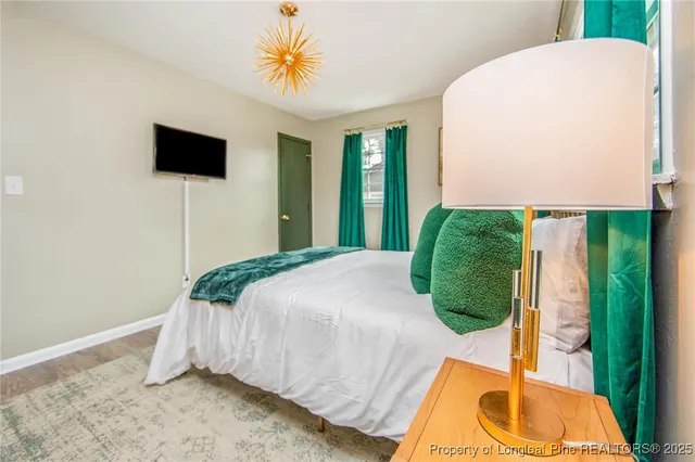 a view of a livingroom with furniture and wooden floor