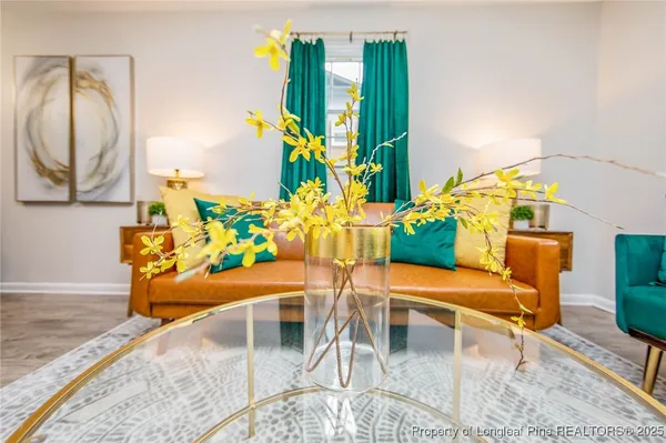 a vase of flowers sitting in front of a window