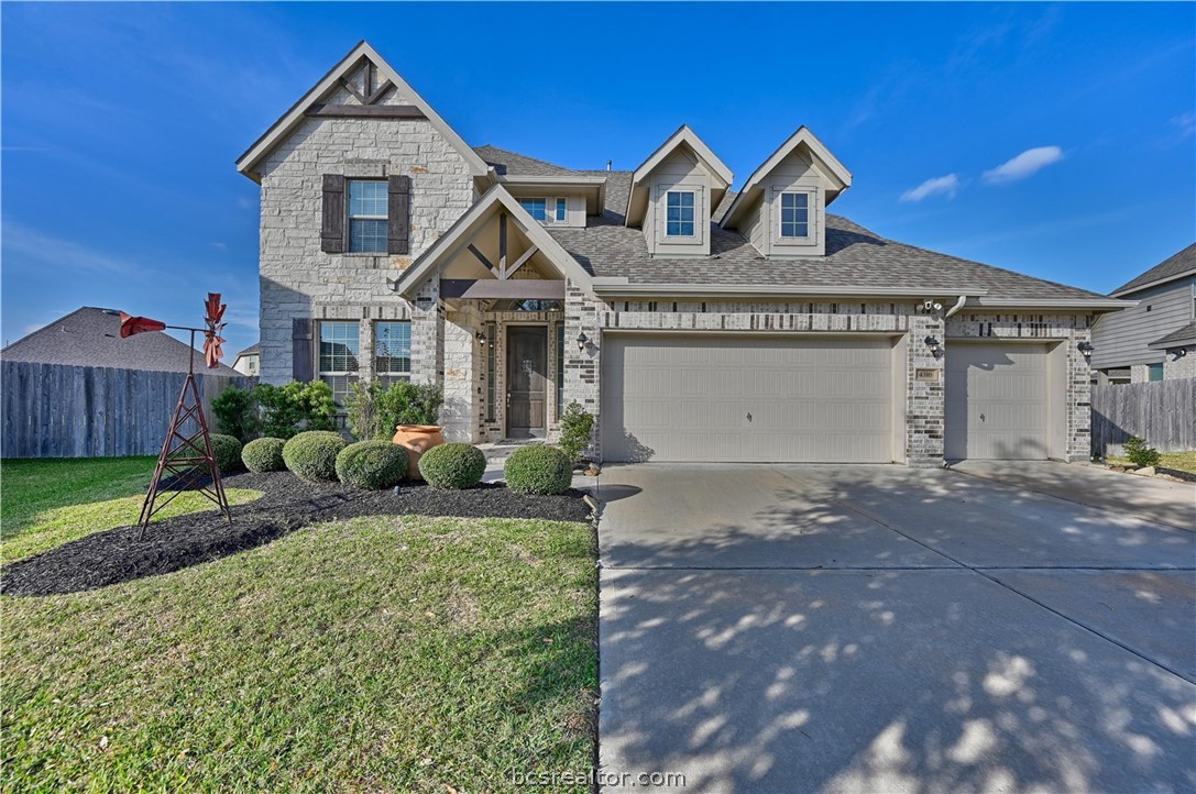 4316 Mocking Run Lane Dickinson, TX 77539 - Photo 1 of 24 a front view of a house with a yard and garage