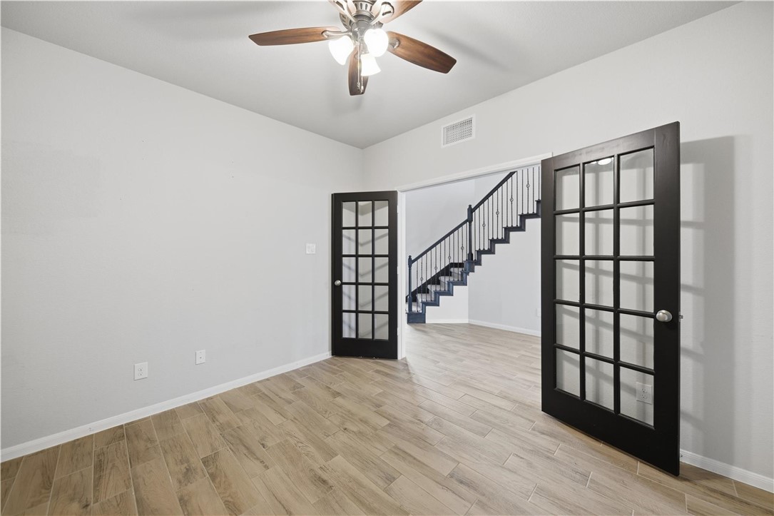 4316 Mocking Run Lane Dickinson, TX 77539 - Photo 15 of 24 a view of entryway and hall with wooden floor