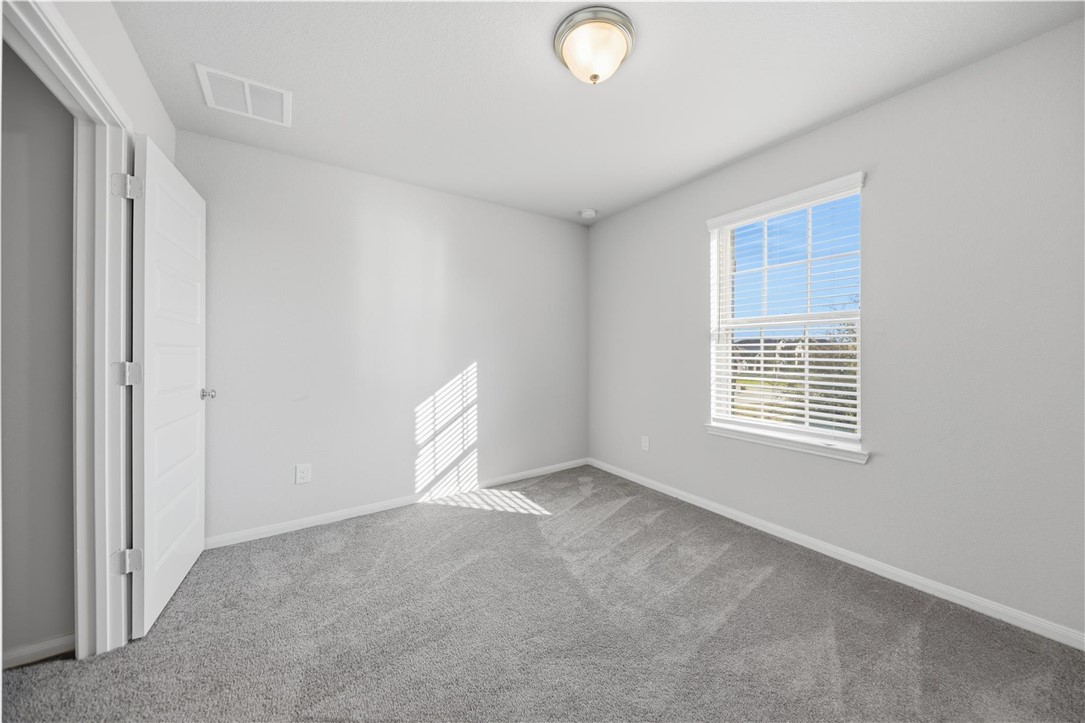 4316 Mocking Run Lane Dickinson, TX 77539 - Photo 16 of 24 a view of an empty room with a window