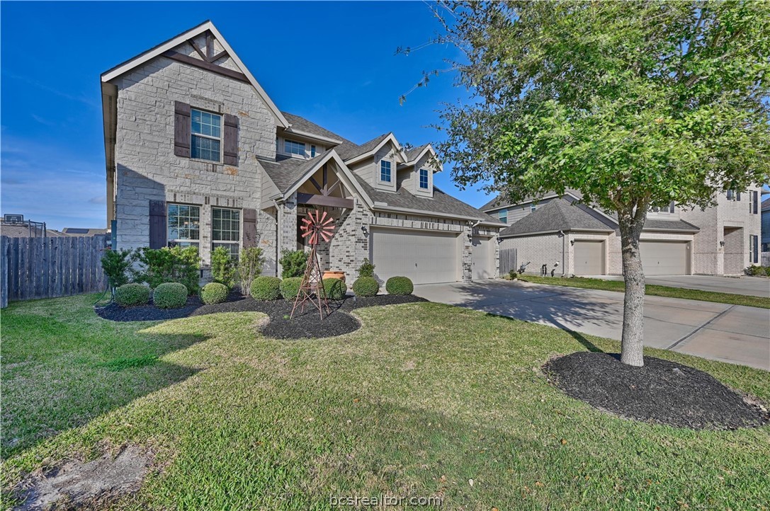 4316 Mocking Run Lane Dickinson, TX 77539 - Photo 2 of 24 a front view of a house with a yard and trees