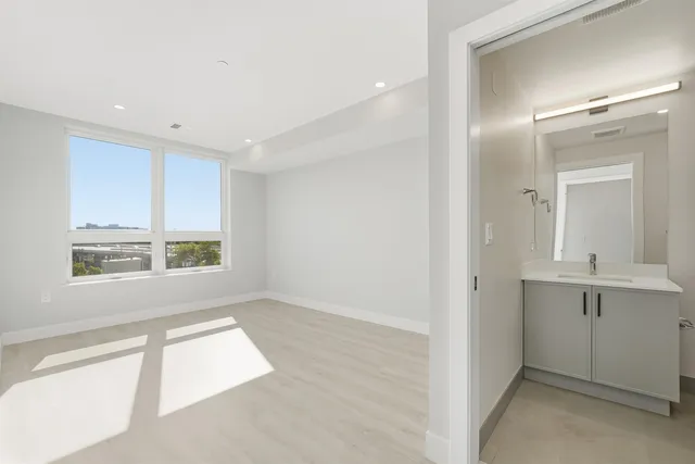 a view of an empty room with a window