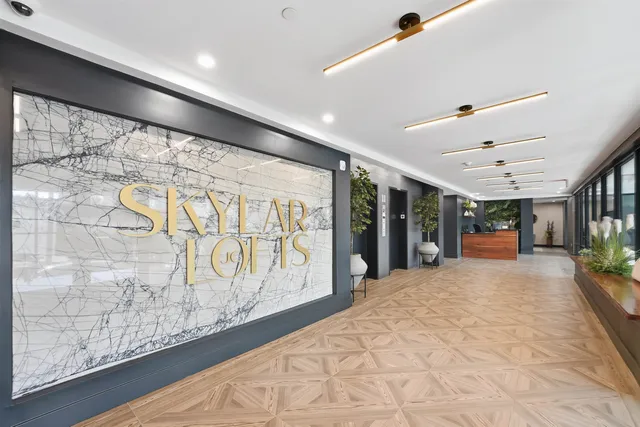 a view of a living room and a livingroom with furniture wooden floor