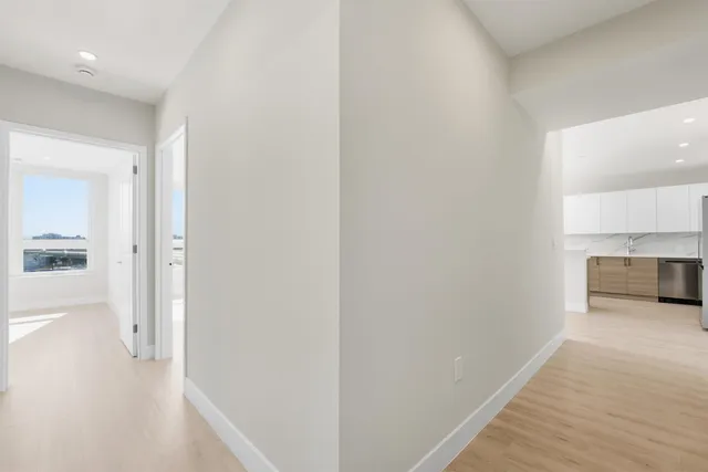 a view of a kitchen from the hallway