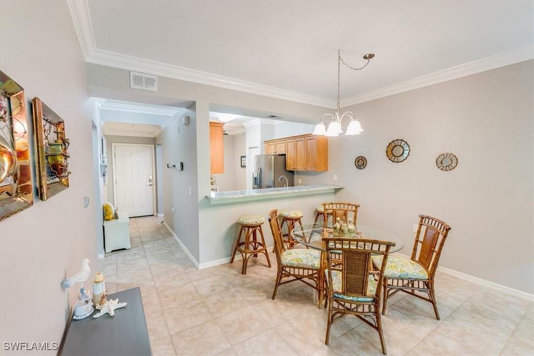 8251 Pathfinder Loop, Unit 615 Fort Myers, FL 33919 - Photo 15 of 44 a dining room with furniture and window