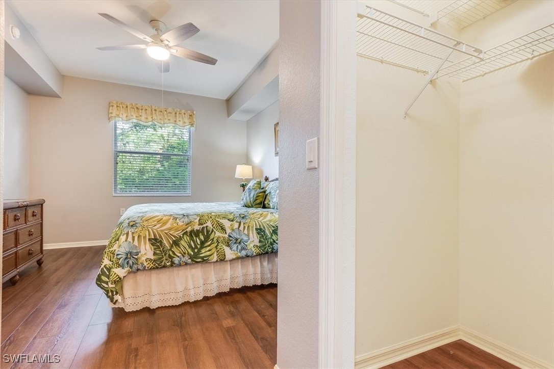 8251 Pathfinder Loop, Unit 615 Fort Myers, FL 33919 - Photo 20 of 44 a bedroom with a bed chandelier and a window