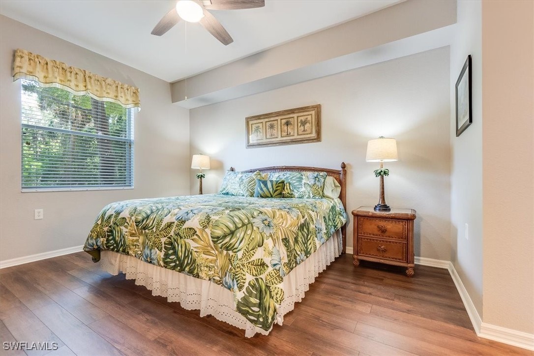 8251 Pathfinder Loop, Unit 615 Fort Myers, FL 33919 - Photo 22 of 44 a bedroom with a bed and a chandelier