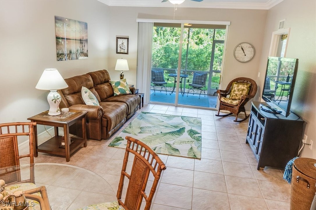 8251 Pathfinder Loop, Unit 615 Fort Myers, FL 33919 - Photo 3 of 44 a living room with furniture and a window