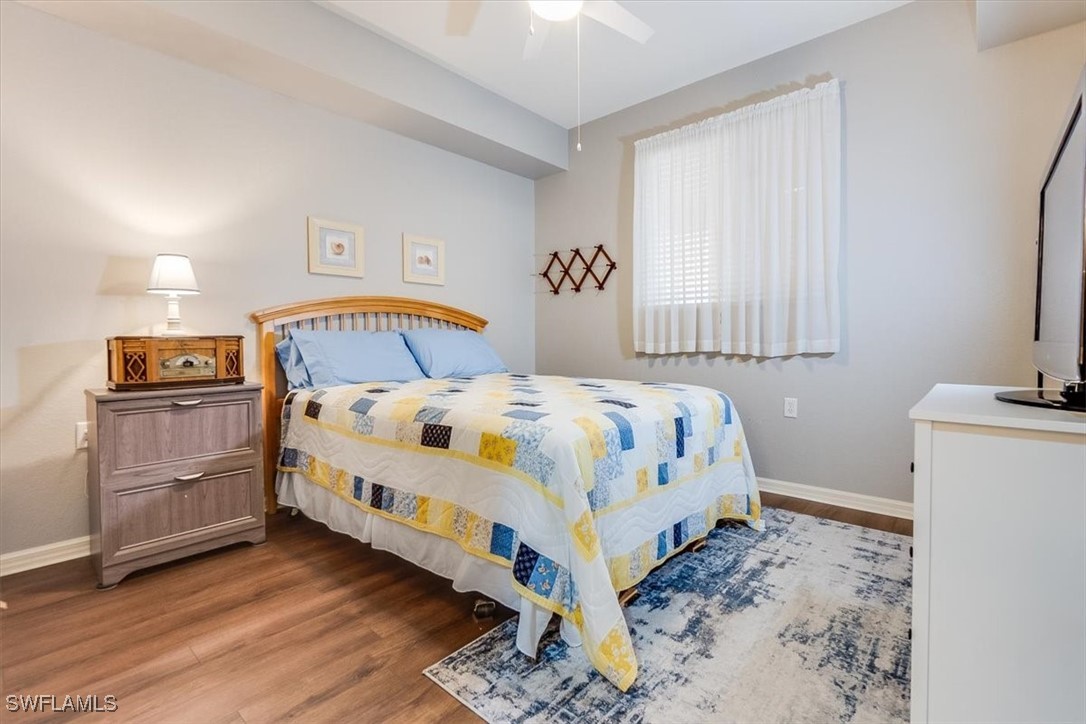 8251 Pathfinder Loop, Unit 615 Fort Myers, FL 33919 - Photo 34 of 44 a bedroom with a bed and a tv