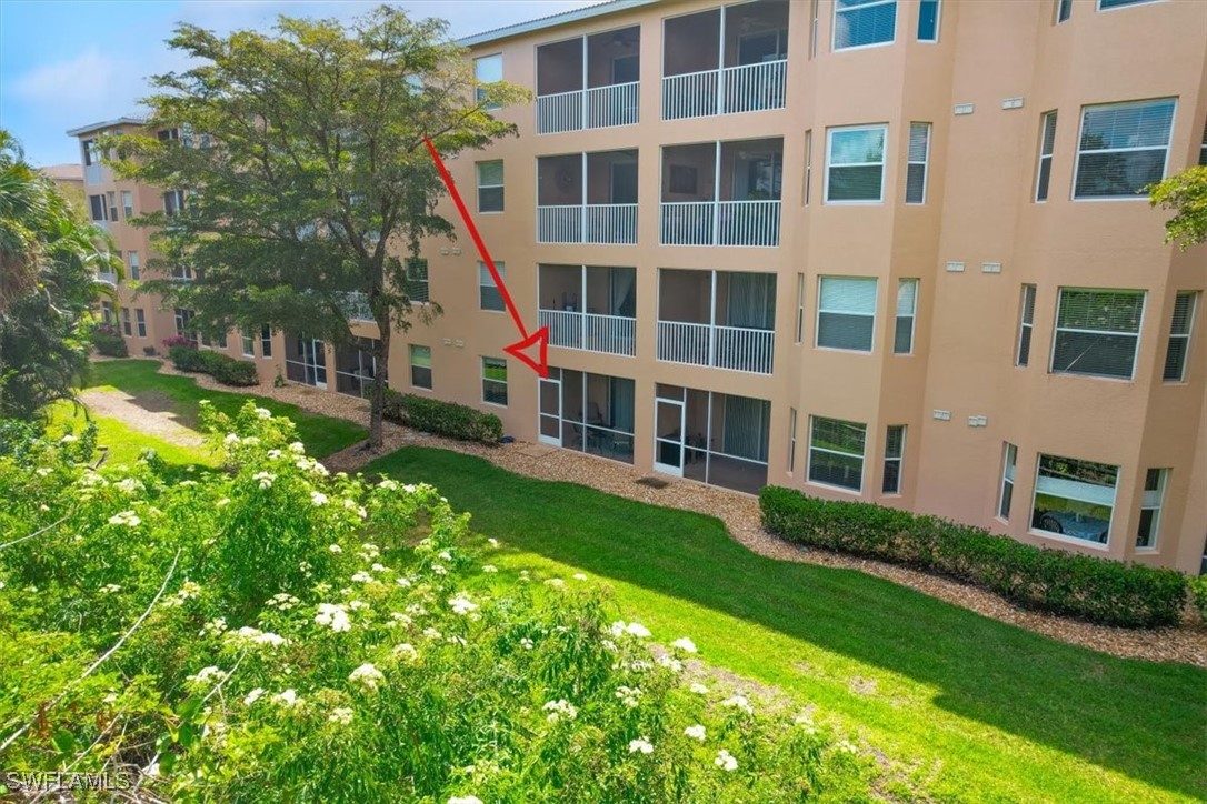 8251 Pathfinder Loop, Unit 615 Fort Myers, FL 33919 - Photo 40 of 44 a view of an apartment with a garden and plants