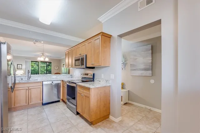 a kitchen with a stove top oven and sink