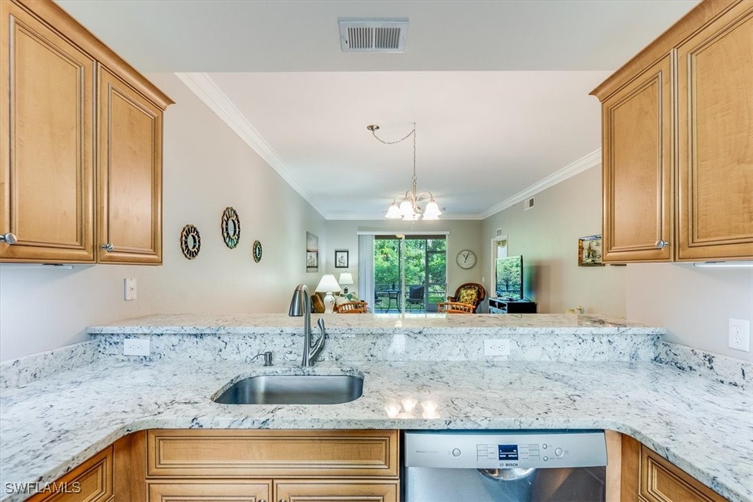 8251 Pathfinder Loop, Unit 615 Fort Myers, FL 33919 - Photo 6 of 44 a kitchen with granite countertop a sink and a window