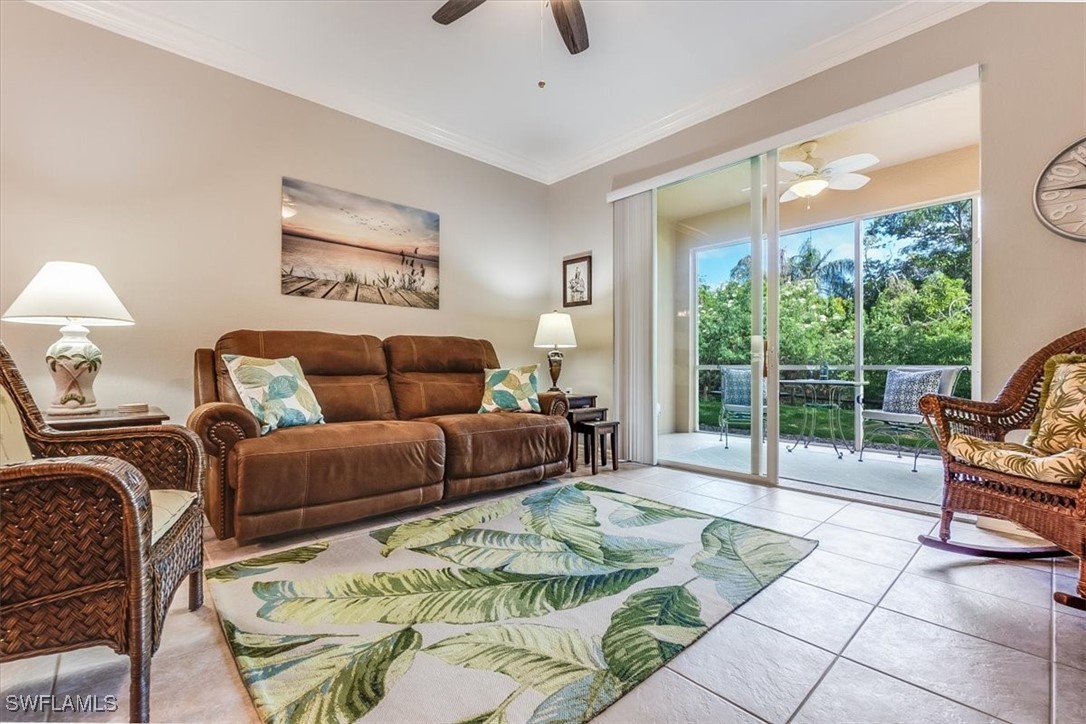 8251 Pathfinder Loop, Unit 615 Fort Myers, FL 33919 - Photo 8 of 44 a bedroom with furniture and a large window