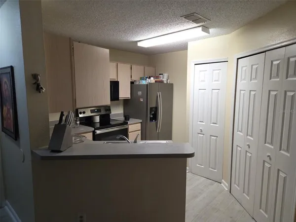 a view of a hallway with closet