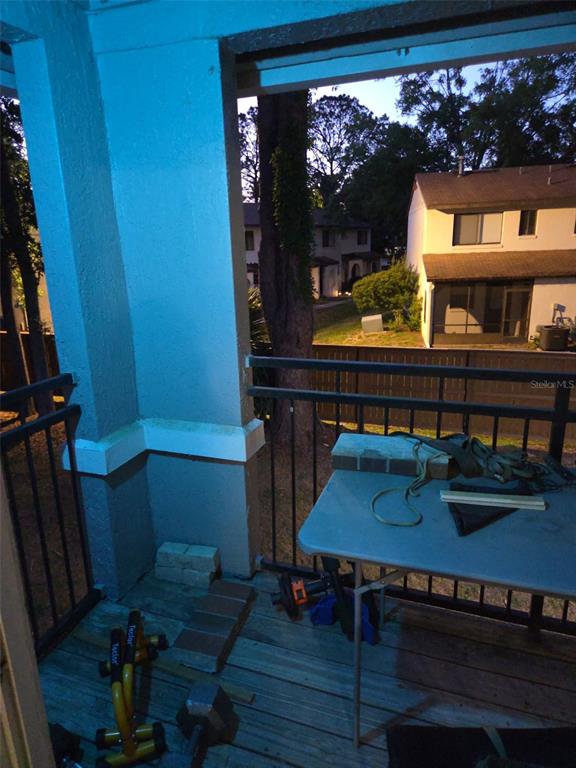 3705 Southwest 27th Street, Unit 422 Gainesville, FL 32608 - Photo 13 of 25 a living room with furniture and a wooden floor