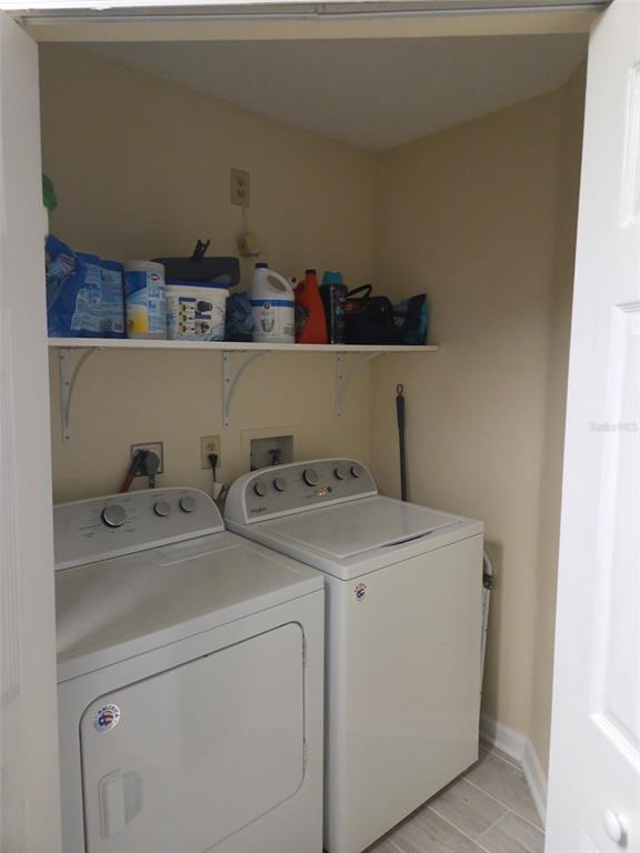 3705 Southwest 27th Street, Unit 422 Gainesville, FL 32608 - Photo 16 of 25 a utility room with dryer and washer