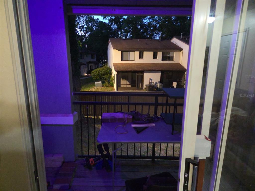 3705 Southwest 27th Street, Unit 422 Gainesville, FL 32608 - Photo 17 of 25 a view of a chairs and a table in a balcony