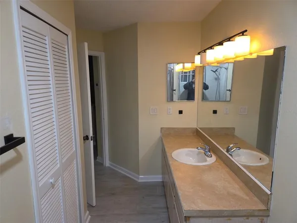 a kitchen with stainless steel appliances granite countertop a refrigerator stove and sink