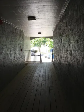 a view of balcony with wooden floor