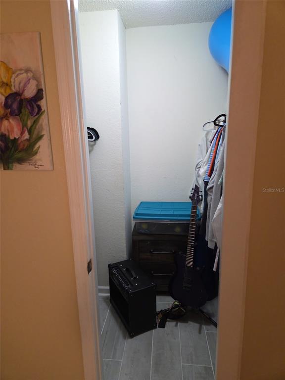 3705 Southwest 27th Street, Unit 422 Gainesville, FL 32608 - Photo 22 of 25 a bathroom with a sink toilet and mirror