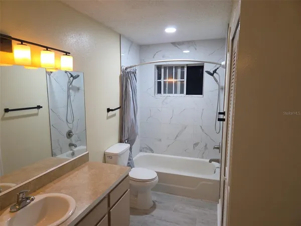 a kitchen with a refrigerator sink and microwave