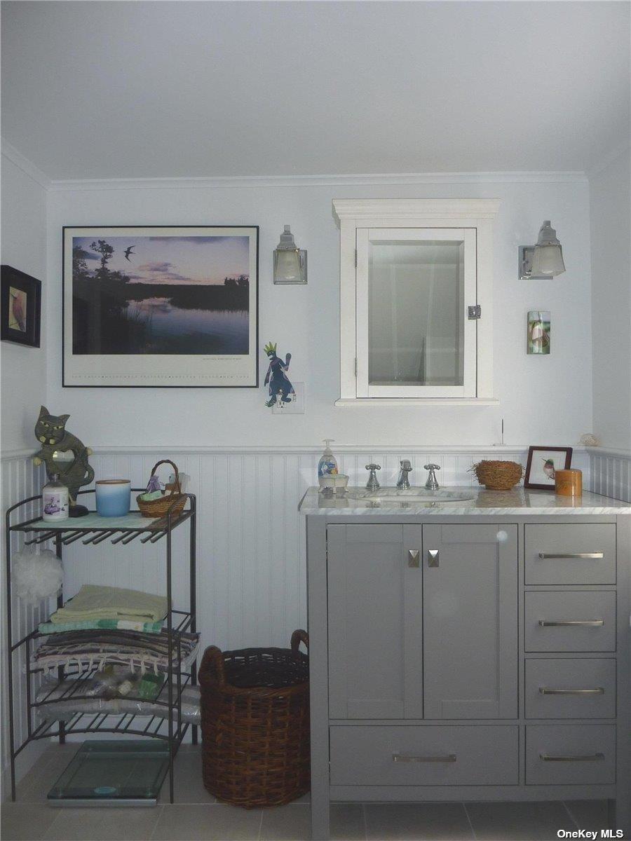 165 Sterling Street Greenport, NY 11944 - Photo 13 of 18 a bathroom with a sink and a mirror