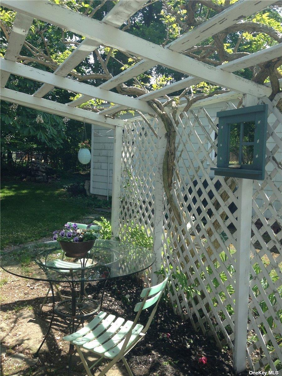 165 Sterling Street Greenport, NY 11944 - Photo 14 of 18 a front view of a house with a yard