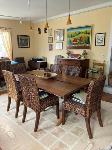a view of a dining room with furniture