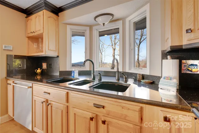 a kitchen with stainless steel appliances granite countertop a stove and a sink