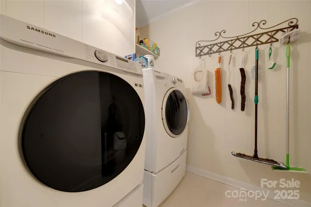 a view of a livingroom with furniture and a bookshelf