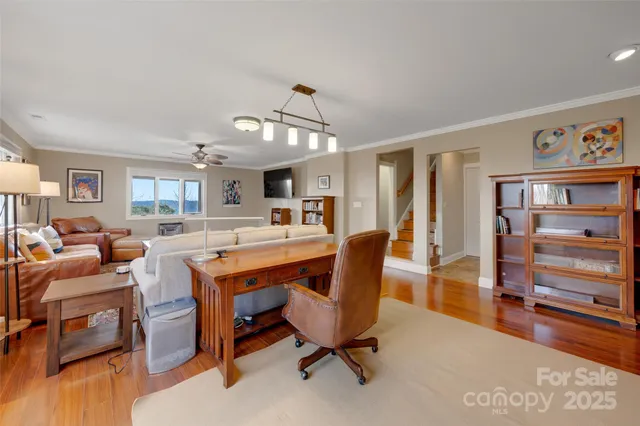 a living room with furniture and a table
