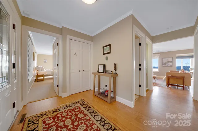 a living room with furniture a rug and a fireplace