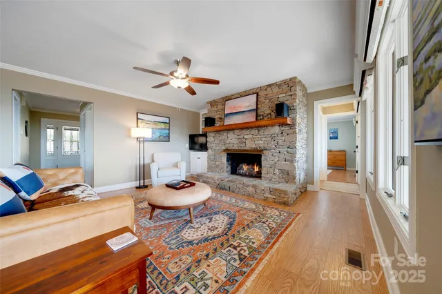 a living room with furniture a rug and a fireplace